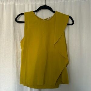 Yellow blouse asymmetric details